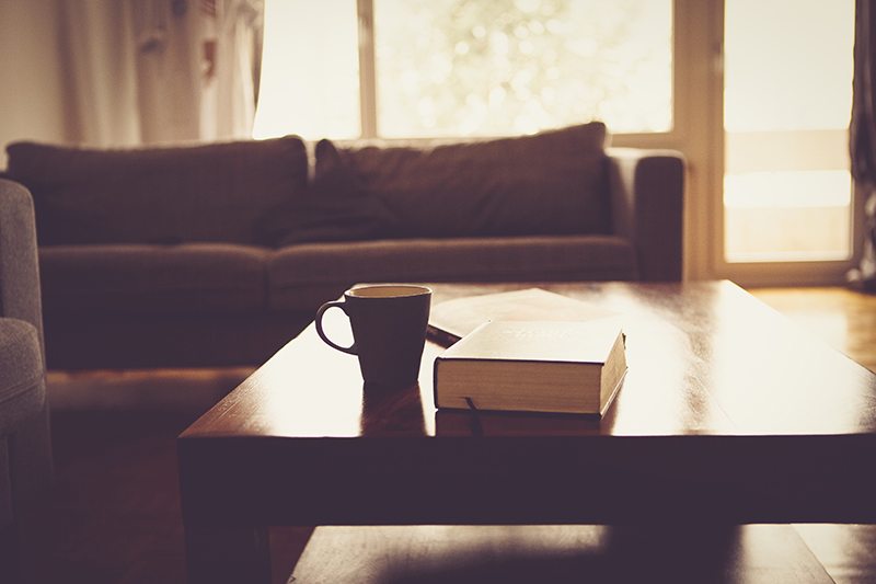 living room table, book, and coffee