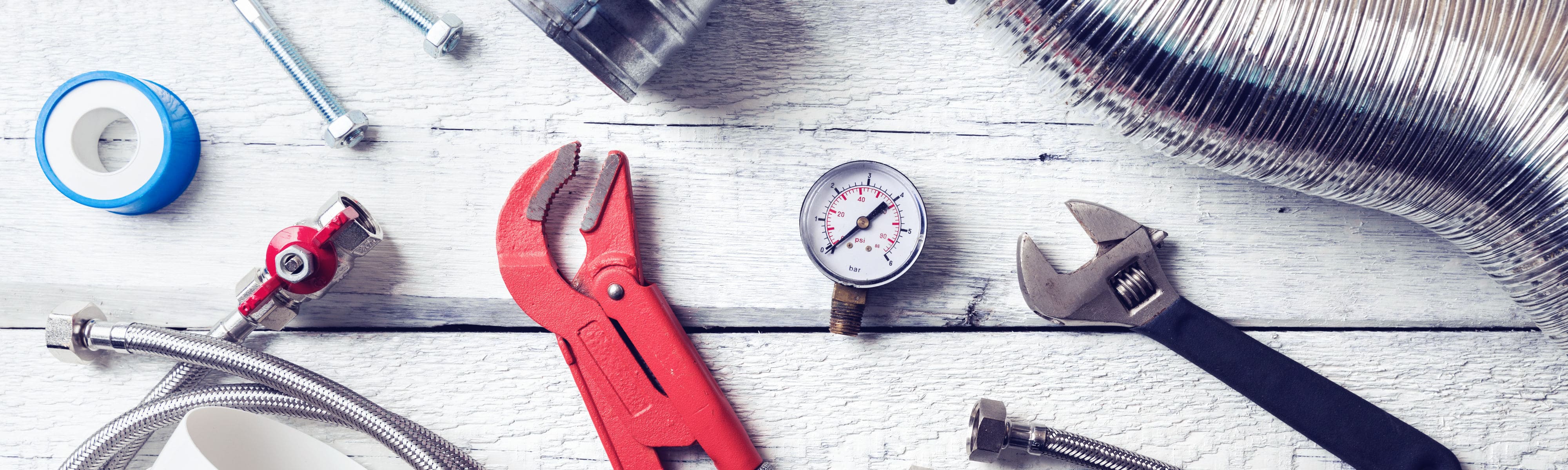 Various tools on a wooden table.