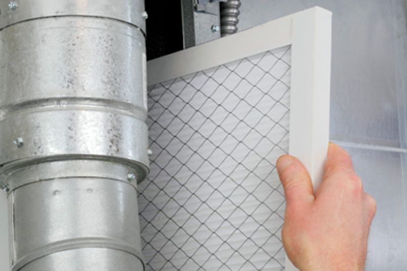 A furnace filter being replaced. What Are Furnace Filters?